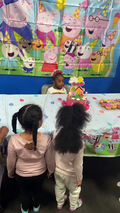 Mischievous kid tries to blow out birthday girl's cake candles but gets stopped just in time