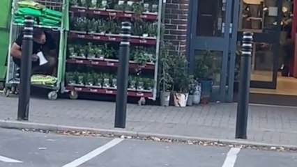 Man sneakingly pranks people with a megaphone as they leave the store