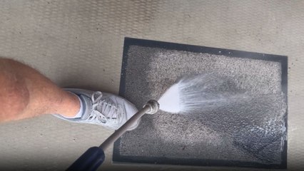 Satisfying process of cleaning a floor mat with pressure washing