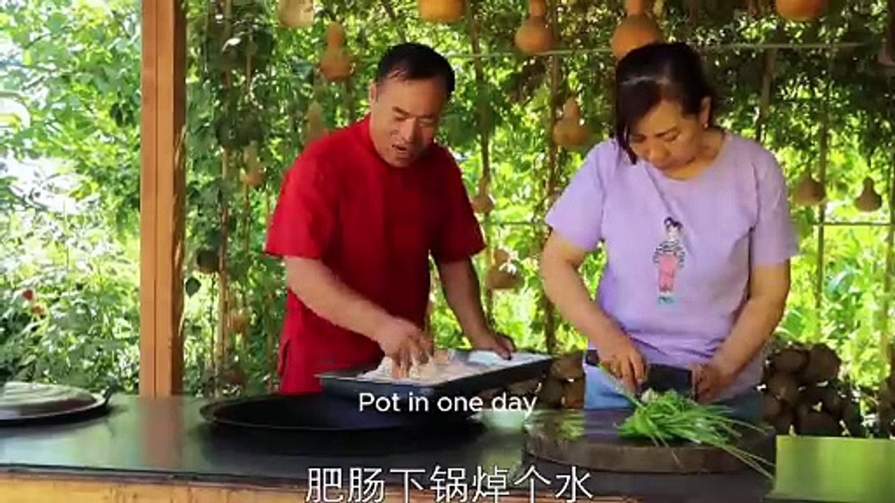 a bunch of fat sausages and spring onions