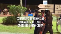 Migrants clash with Moroccan police for third night in a row as they attempt to enter Ceuta