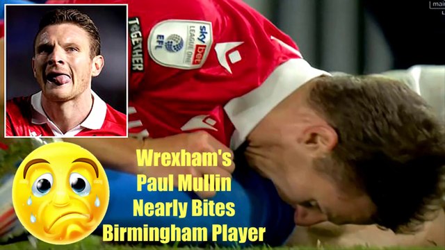 Wrexham's Paul Mullin appears to almost BITE a Birmingham City player during the clash at St Andrew's - with the star striker sharing a hilarious explanation on social media as the clip goes viral