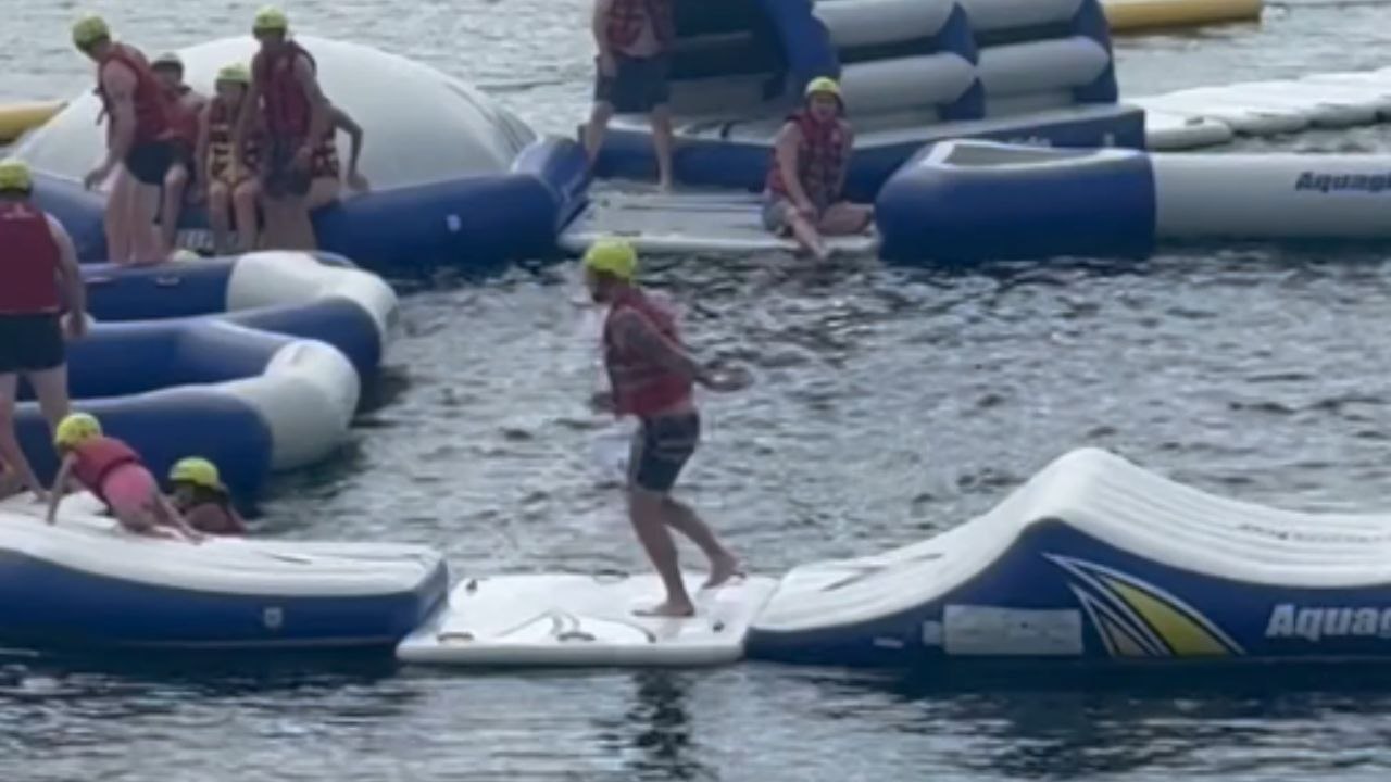 Inflatable chaos ensues as people struggle to complete Aquaglide challenge track