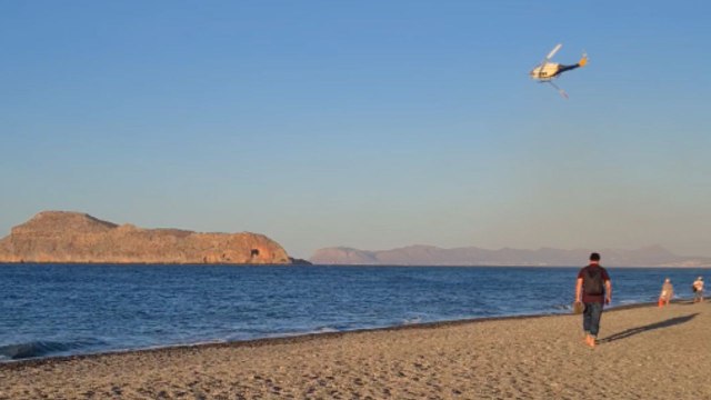 Wildfire near popular Greek resort filmed as helicopters work to control the raging flames