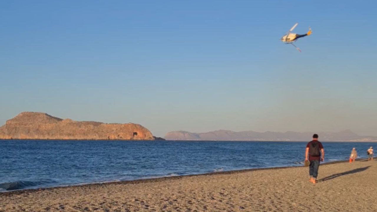 Wildfire near popular Greek resort filmed as helicopters work to control the raging flames