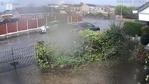 Lightning hits house and cars submerged as storms strike Britain