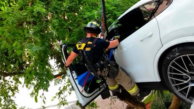 Woman rescued after crash leaves Porsche dangling from Florida car park