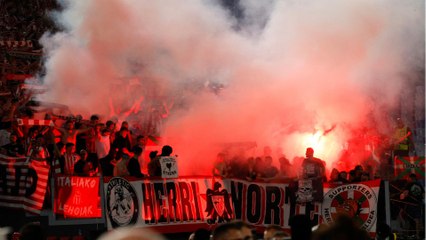 The Athletic Club fans launched flares at the Olympic Stadium.