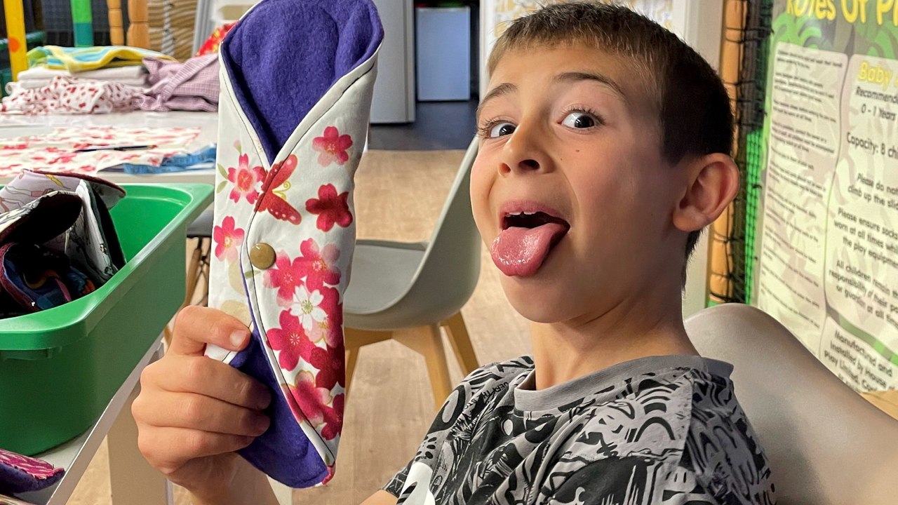 Boy, 8, making reusable pads for charity to com...