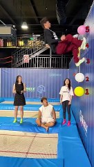 Trampoline hits balloons_ head_ buttocks_ feet_ combination_ are you pretending to be explosive_