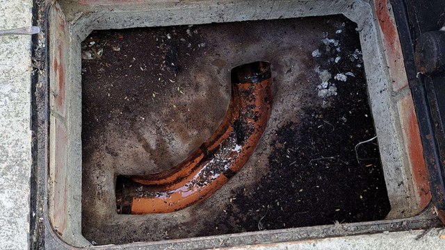 Resident says raw sewage spills over his driveway every time it heavily rains