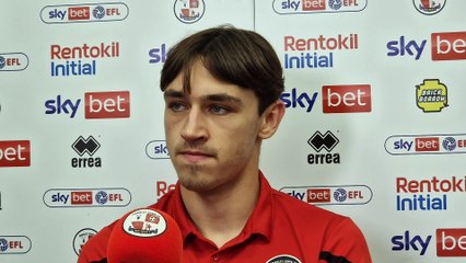 Crawley Town defender Josh Flint reacts to defeat against Bolton Wanderers