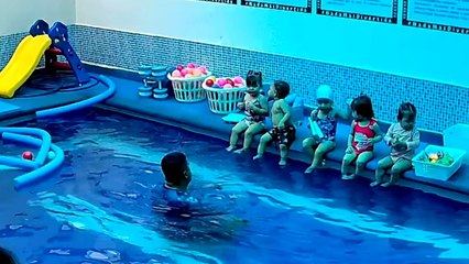 Little boy slips into the pool while trying to comfort his crying mate