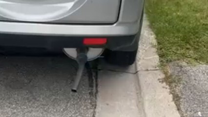 Bizarre noises emerge from car exhaust after bike inner tube is attached to it