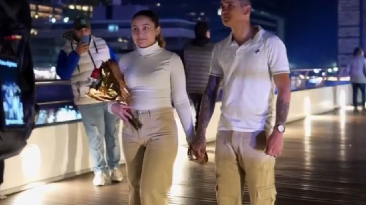 Couple kicks off a new chapter in their life with hugs and kisses