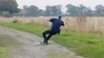 Amusing moment man falls over while walking his dog