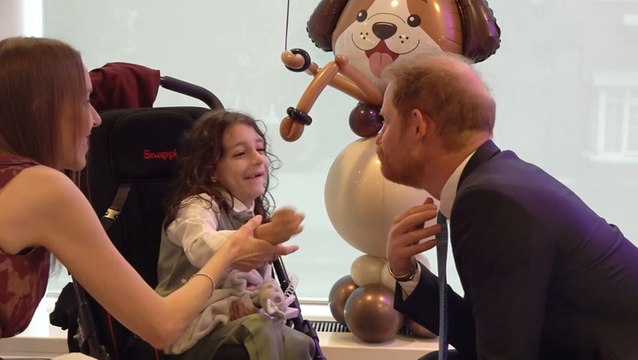 Prince Harry bursts out laughing as young boy grabs his beard at WellChild charity event