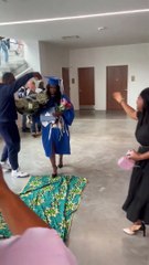 Woman graduates from college and participates in the Liberian tradition of walking on Lapp