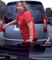Woman jumps in front of car to help husband cut into traffic