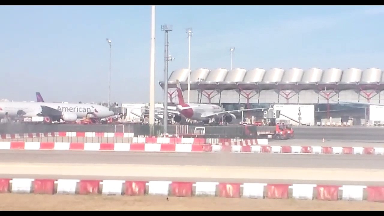 Iberia Airbus A321 landing at Adolfo Suárez Madrid–Barajas Airport and taxiing past Terminal 4S to arrive at Terminal 4