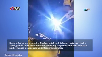Bikin Silau Pengendara Lain, Oknum Ojol Dihukum Pelototi Lampu Motornya Sendiri