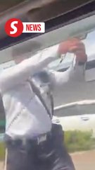 Cop points gun to stop man from escaping roadblock in Tawau