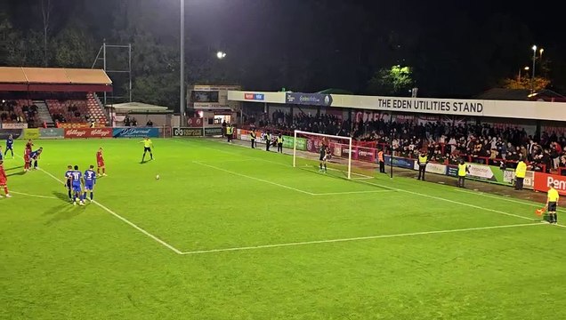 Ronan Darcy scores a penalty for Crawley Town against AFC Wimbledon