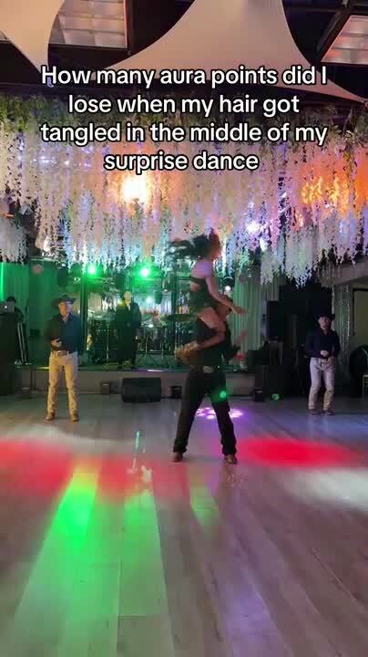 Girl's Hair Gets Tangled in Floral Decorations While Performing at Quinceanera