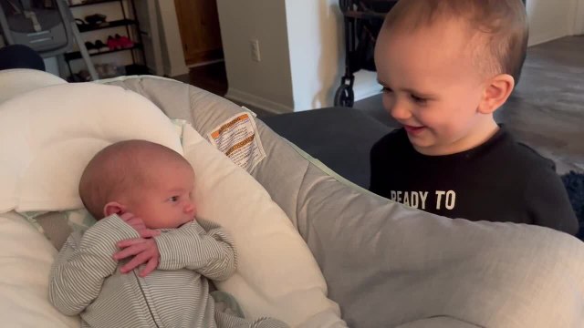 Toddler Chuckles While Meeting His Newborn Brother For First Time