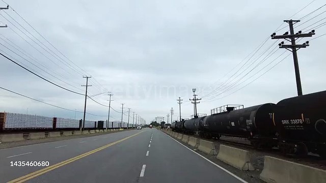 Freight trains loaded with merchandise and fuel tanks in Baltimore - 4K stock video
