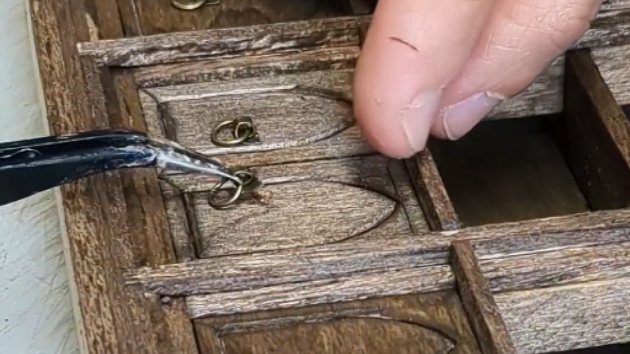 Creative montage captures the process of building a beautiful Gothic bookshelf with tiny books