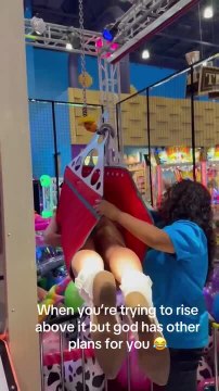 Woman Trying Human Claw Machine Falls From Machine Not Being Rigged Properly