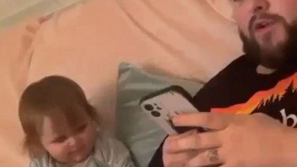 Adorable princess smacks dad with toy after he tells her off