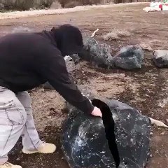 An enormous obsidian stone split in half