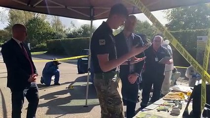 Prince William receives talk on forensics from Duchy College student