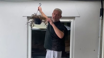 Wife gets soaked after husband cleverly pulls off water prank