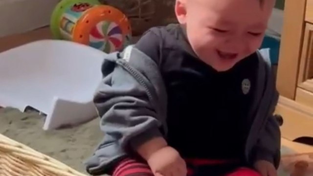 Adorable baby laughs uncontrollably while watching his favorite toys fly
