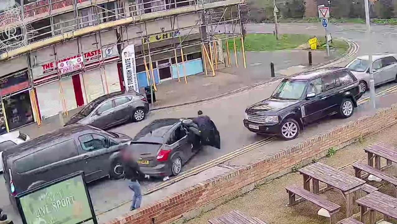 Police officer clings to car door for more than 700 metres as suspect speeds off