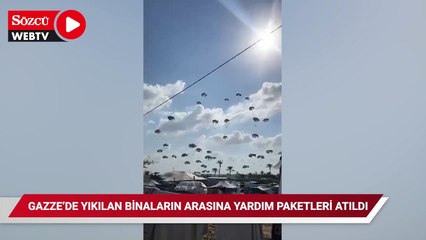 Скачать видео: Gazze'de yıkılan binaların arasına yardım paketleri atıldı