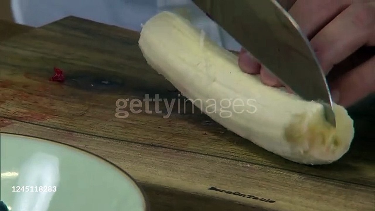 gettyimages-1245118283-640_adppCutting banana - HD stock video