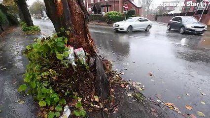 Tributes at the scene of the fatal crash on Dixons Green Road, Dudley.
