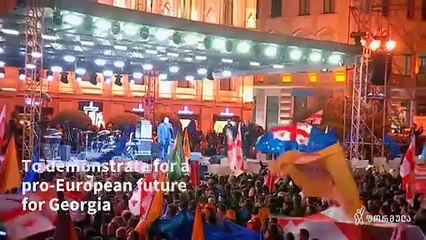 Huge crowd wave flags, sing at pro-EU rally in Georgia ahead of vote