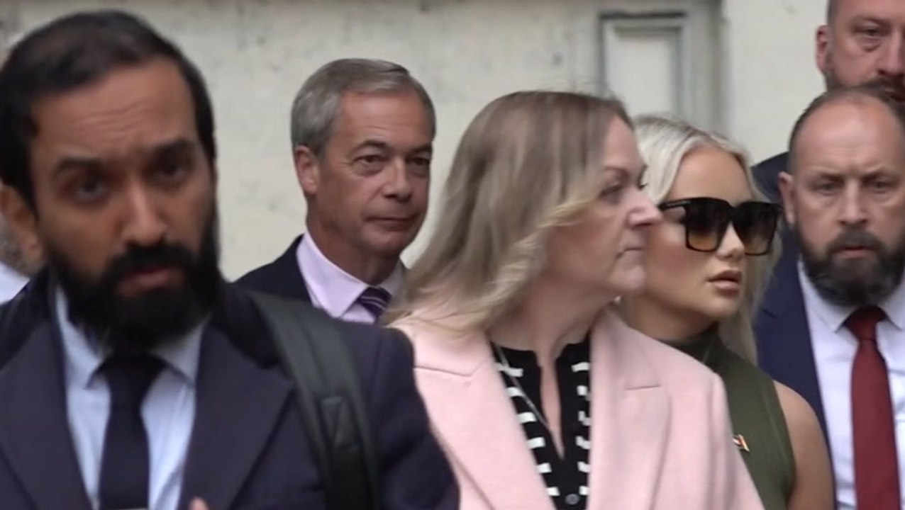 Nigel Farage waves to supporters outside court as woman admits throwing