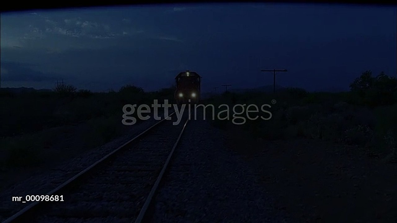 gettyimages-mr_00098681-640_adppPAN Train moving down the tracks as darkness falls - HD stock video