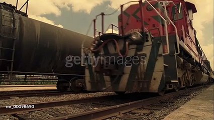 gettyimages-mr_00098690-640_adppPAN One train with tanker cars idling and another with passenger cars rolling past - HD stock video