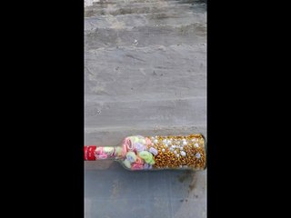 Breaking glass bottle colorful video