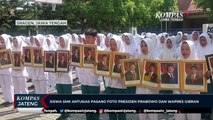 Siswa SMK Antusias Pasang Foto Presiden Prabowo dan Wapres Gibran