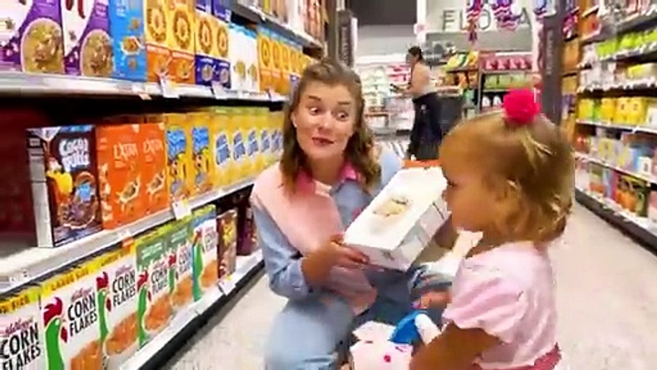 Alice shopping in a Toy Store for a new Doll