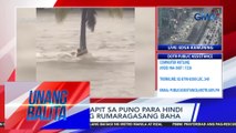 Lalaki, kumapit sa puno para hindi tangayin ng rumaragasang baha | Unang Balita