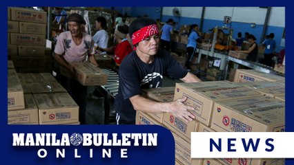 Volunteers assist in repacking relief goods at DSWD in Pasay